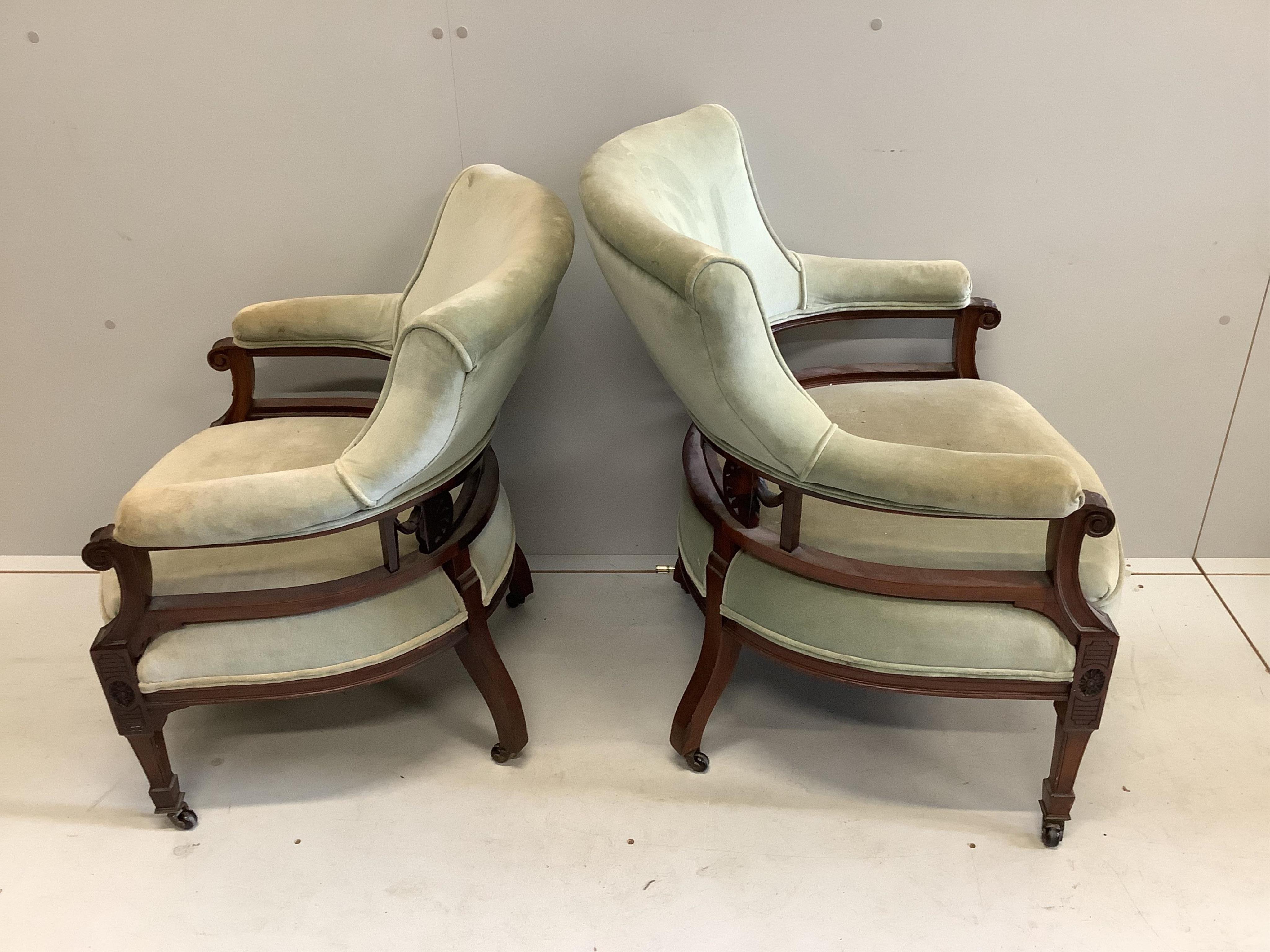 Two Victorian upholstered mahogany tub armchairs, larger width 65cm, depth 56cm, height 80cm. Condition - fair